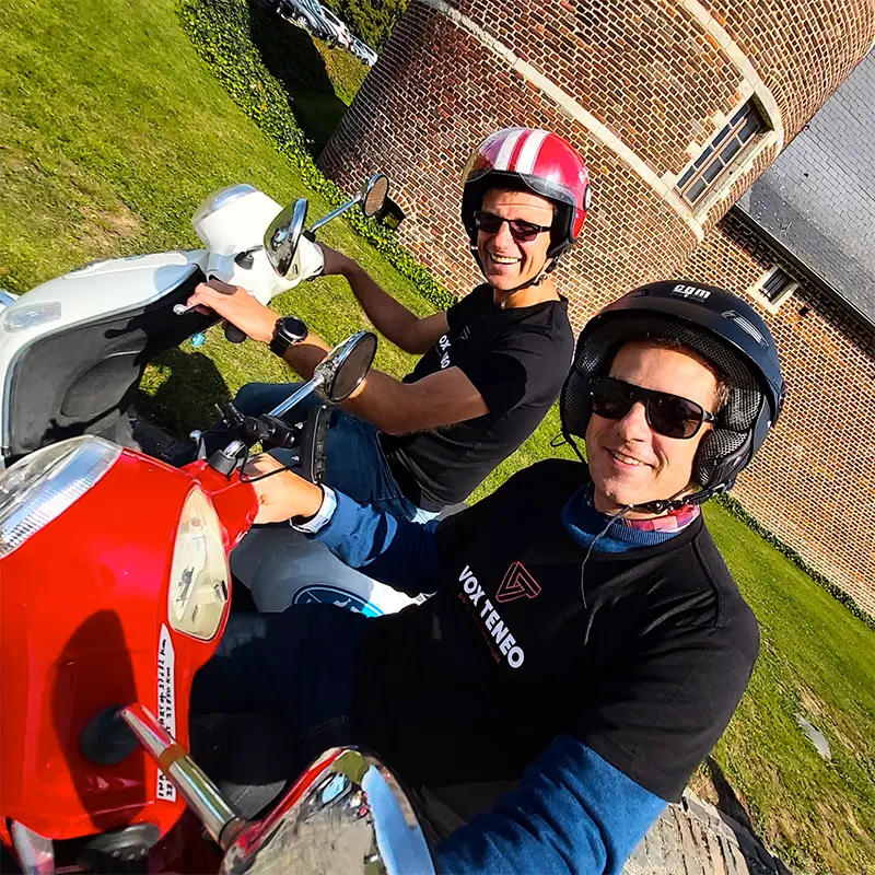 Two colleagues out on scooters on a team day