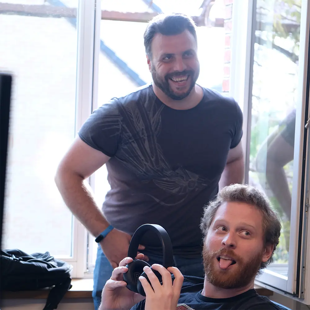 Colleagues working together at a shared desk